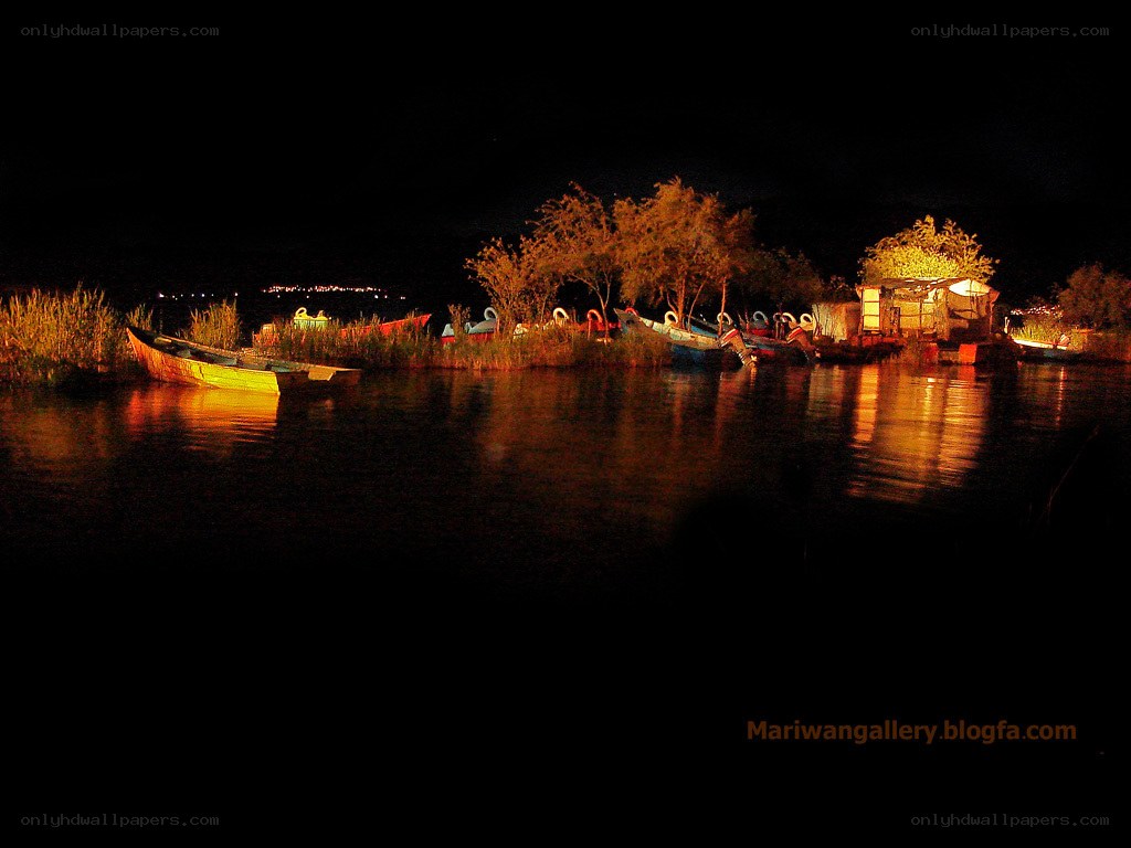 Night boats on a lake