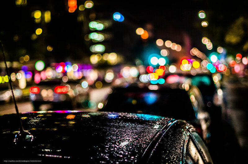 Night city lights on wet car