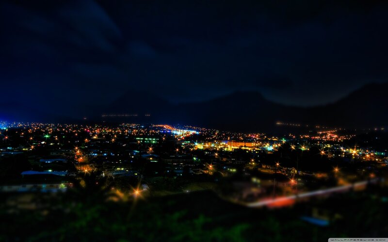 night city lights with mountains