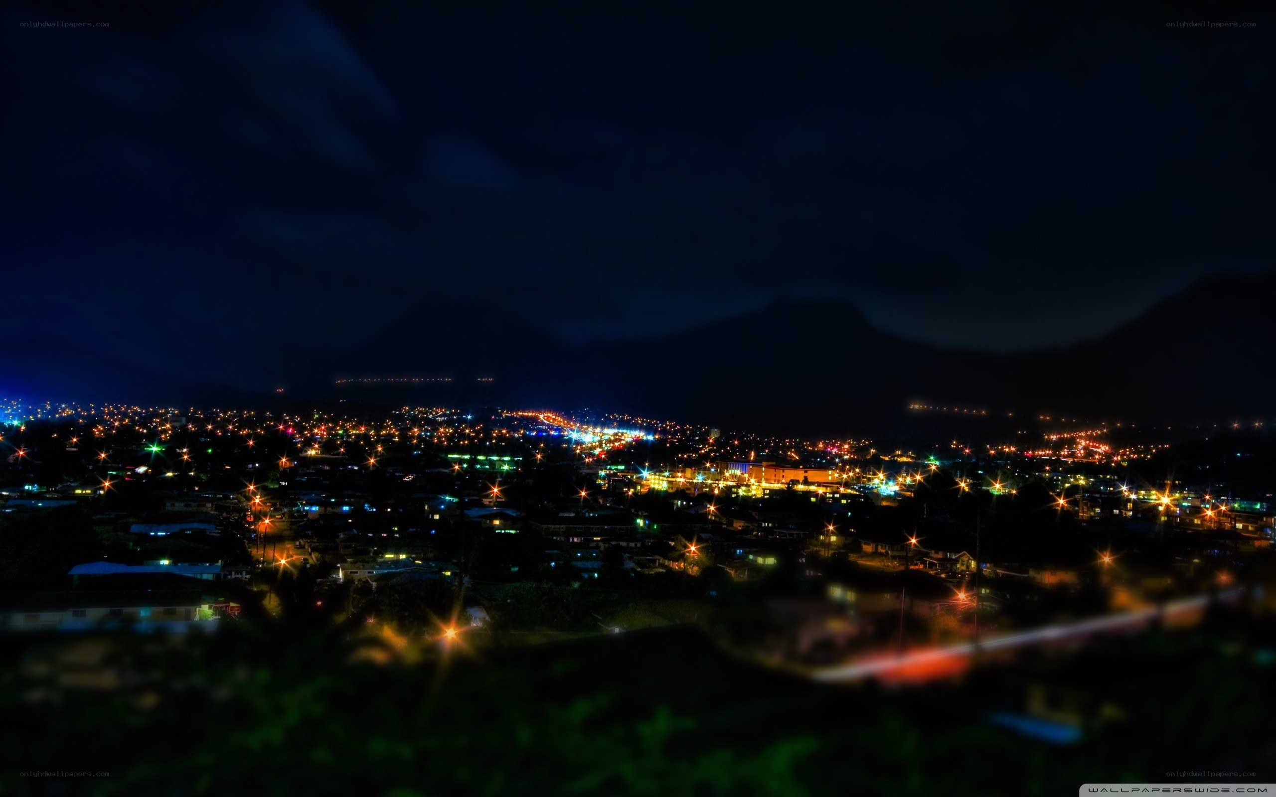 night city lights with mountains