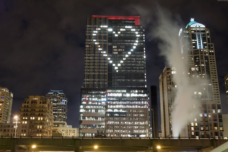 Night city skyline with steam