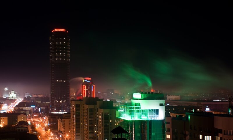night cityscape with green lights