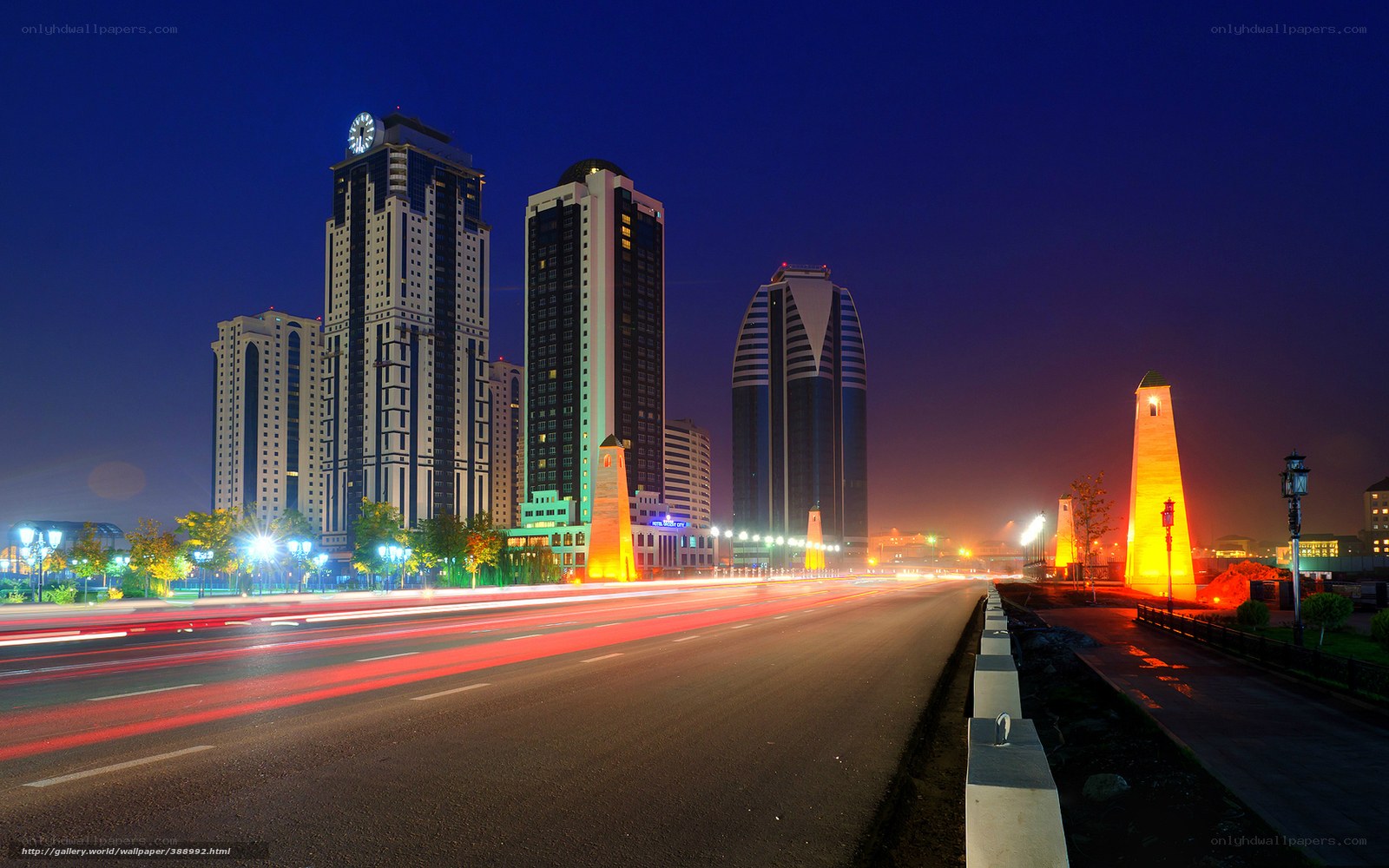 Night cityscape with illuminated towers