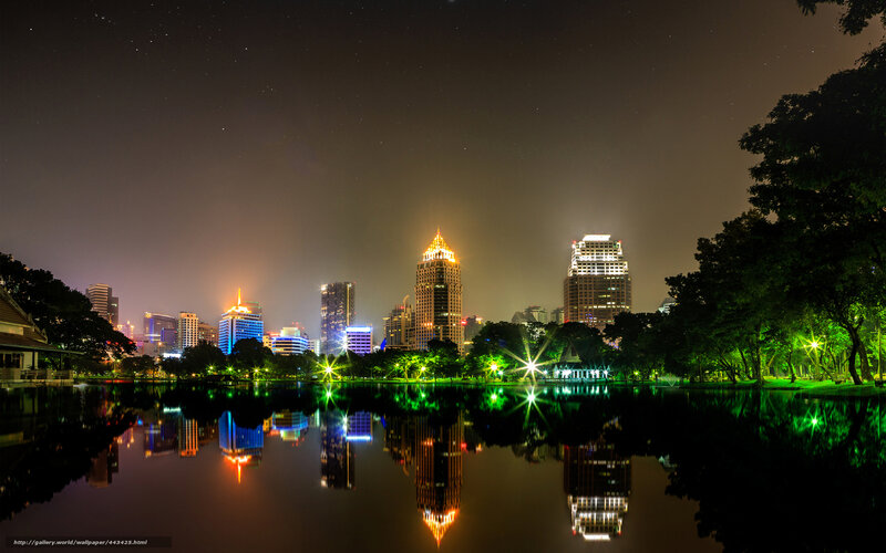 Night cityscape with lake reflection