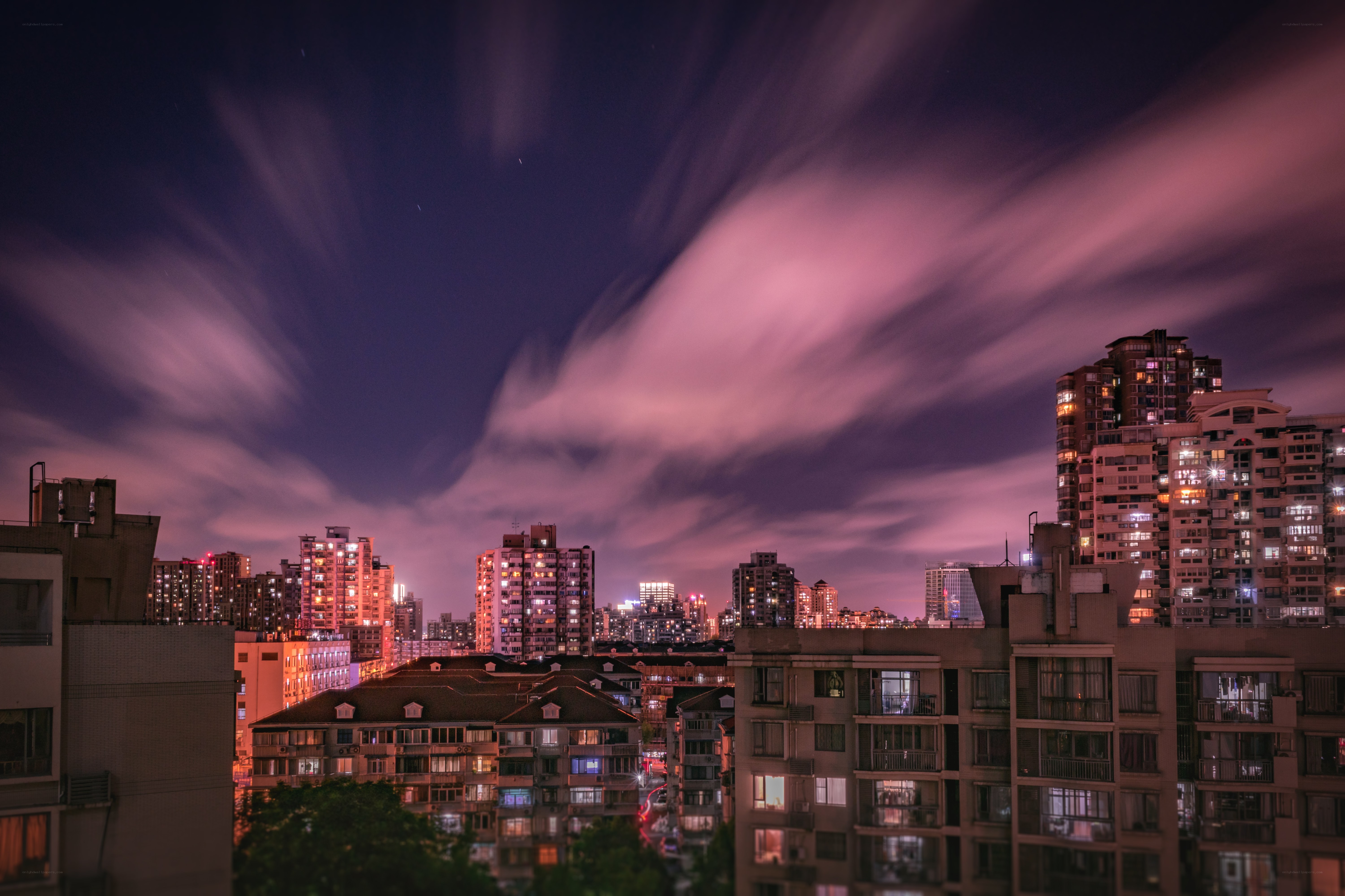 Night cityscape with purple sky