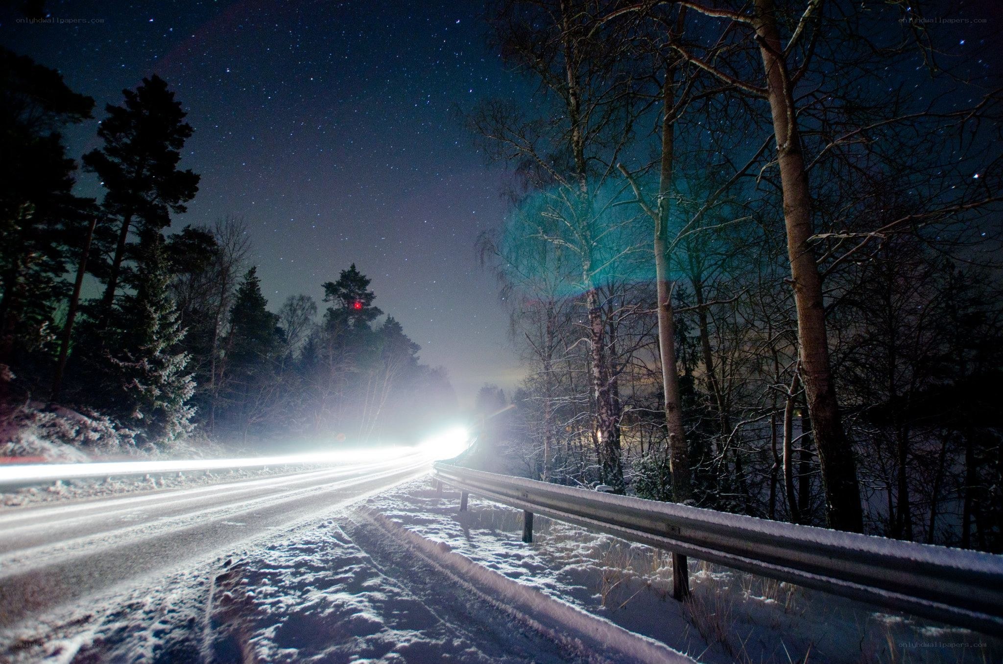 Night drive on a snowy road