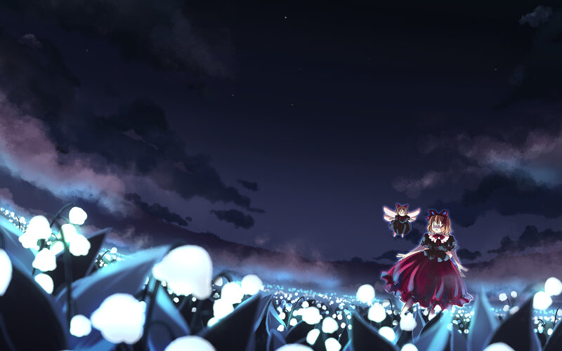 Night field with glowing flowers