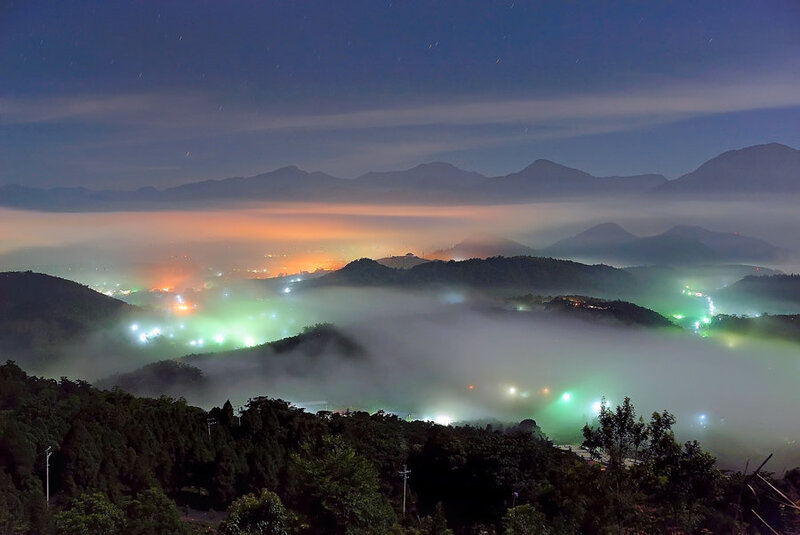 Night fog over mountain valley