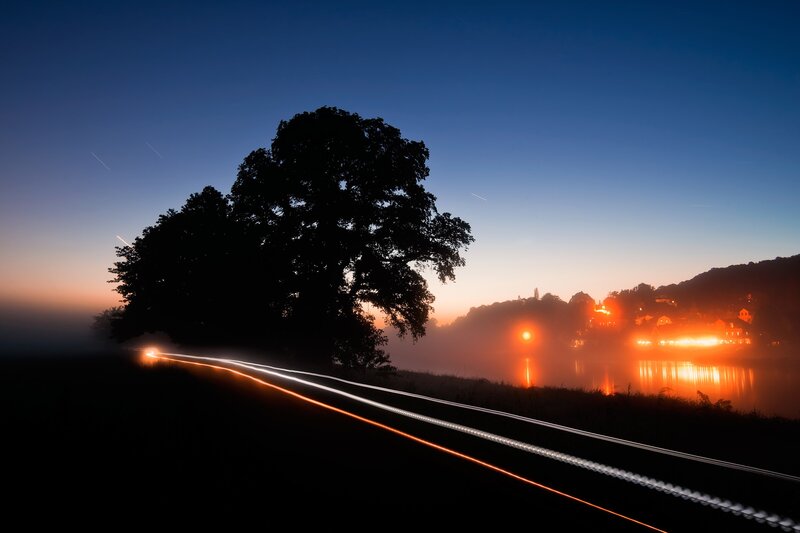 Night lights on a misty river