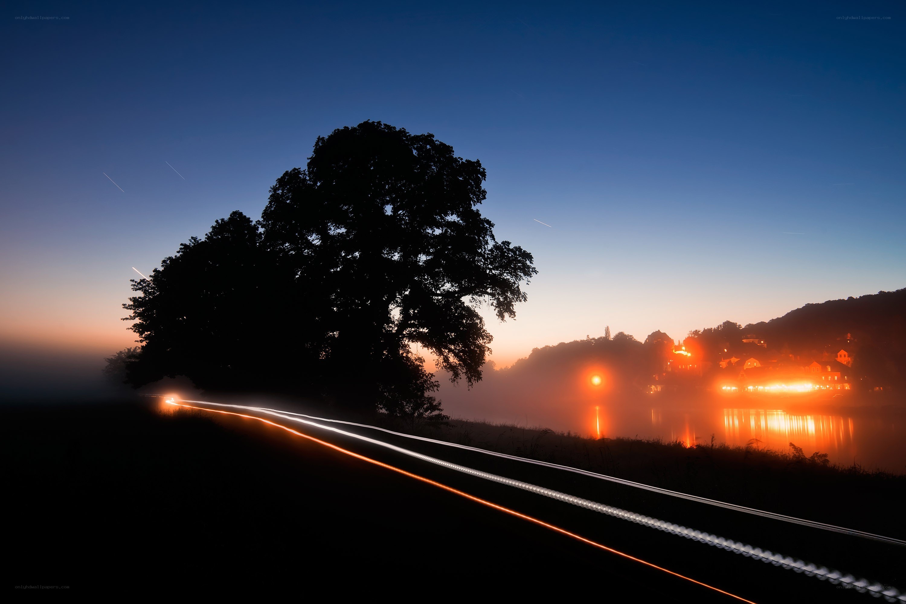 Night lights on a misty river