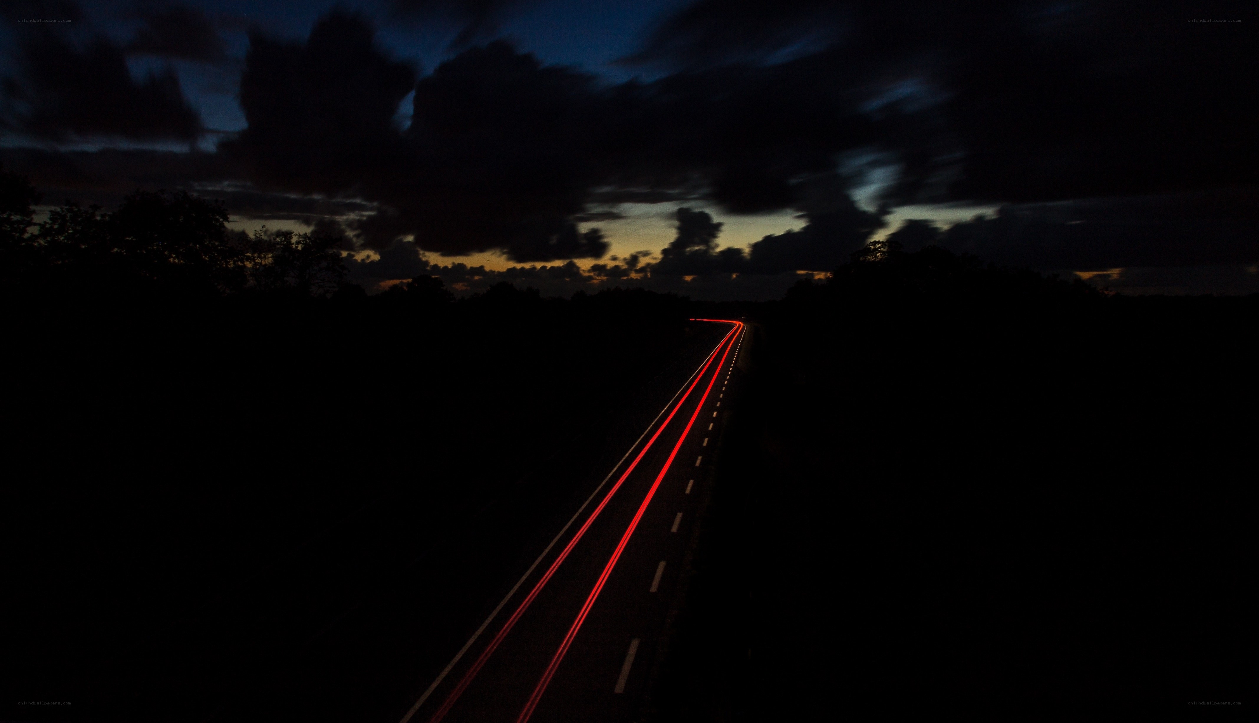 Night road with light trails