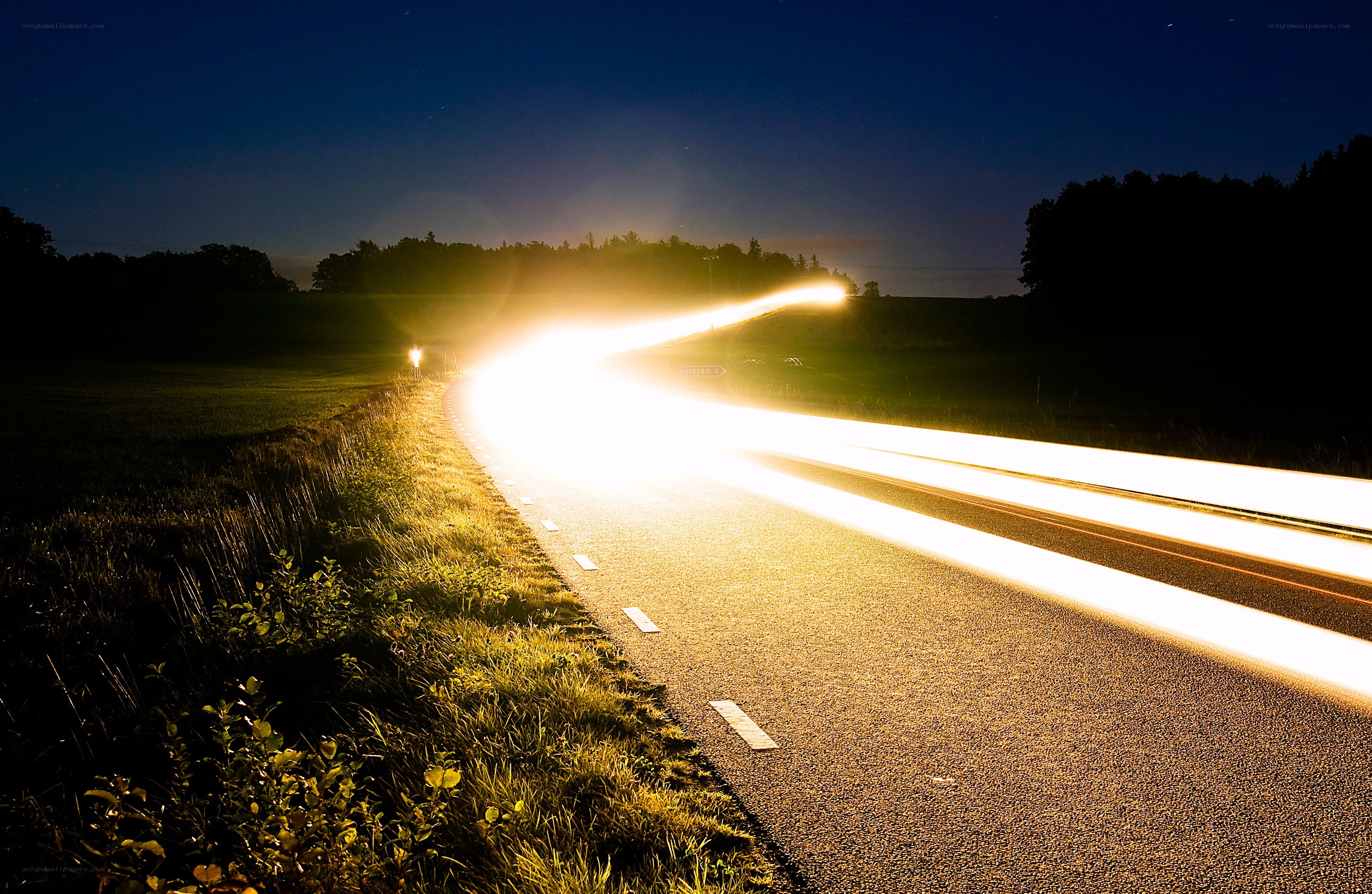 Night road with light trails