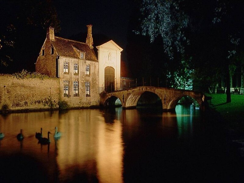 Night scene of historic bridge and house