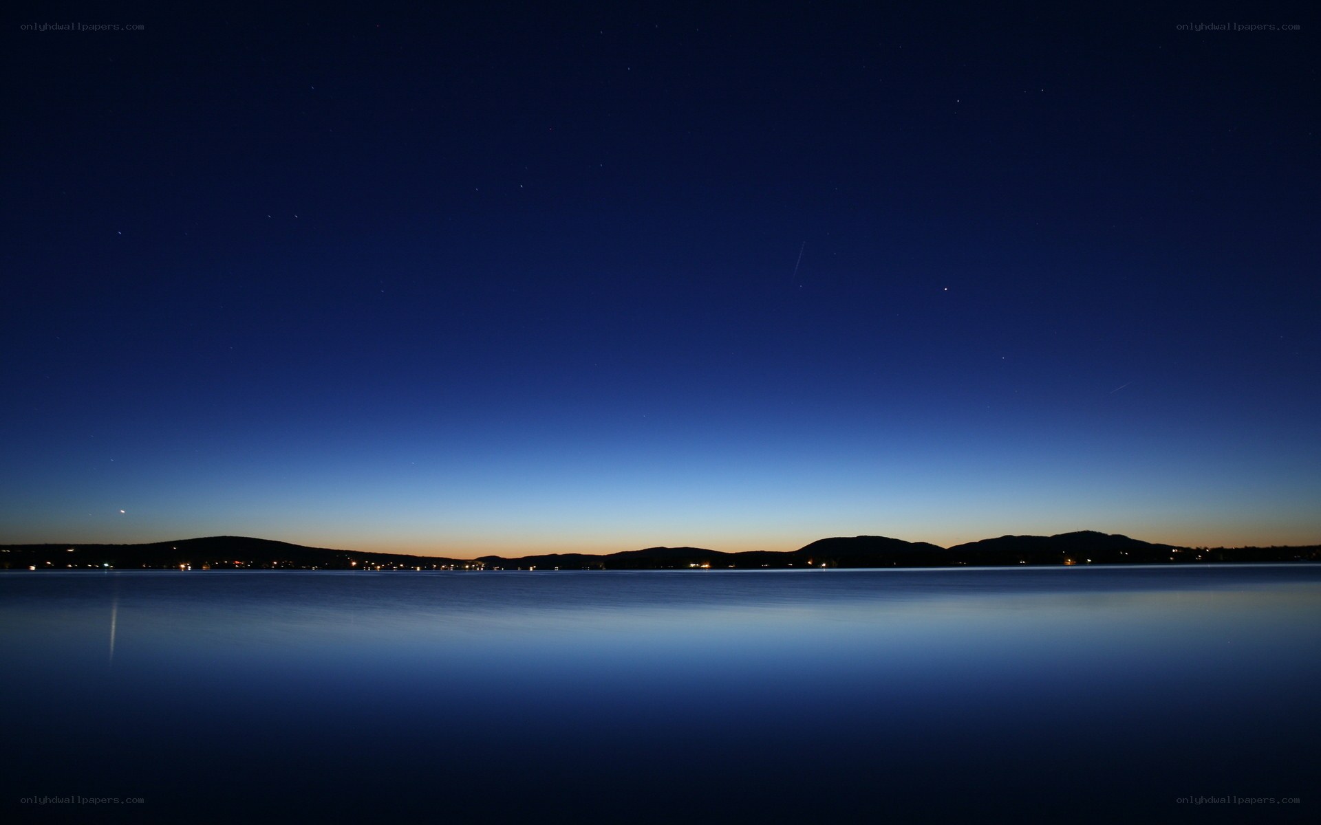 Night sky over a calm lake