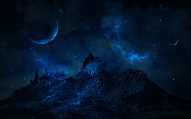 Night sky over alien mountains
