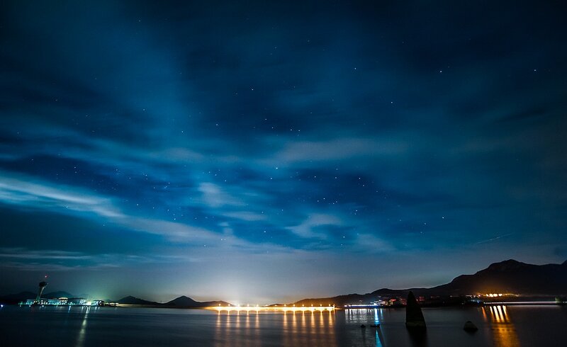 night sky over coastal city
