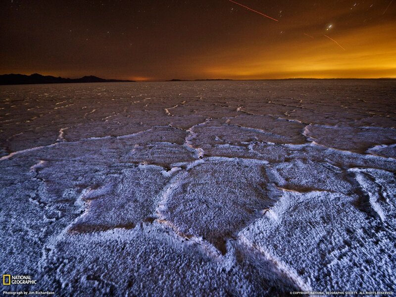 Night sky over cracked salt flats