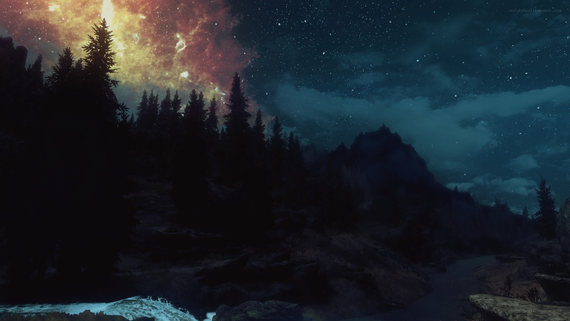 night sky over forest and mountains
