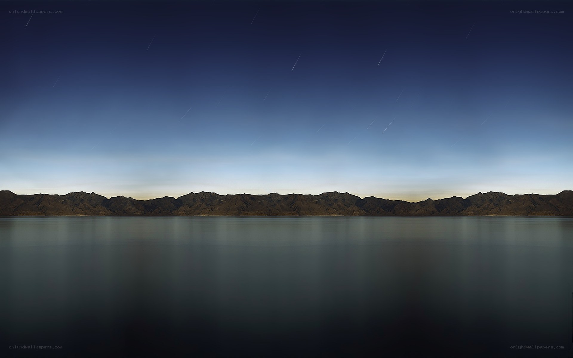 night sky over mountain lake