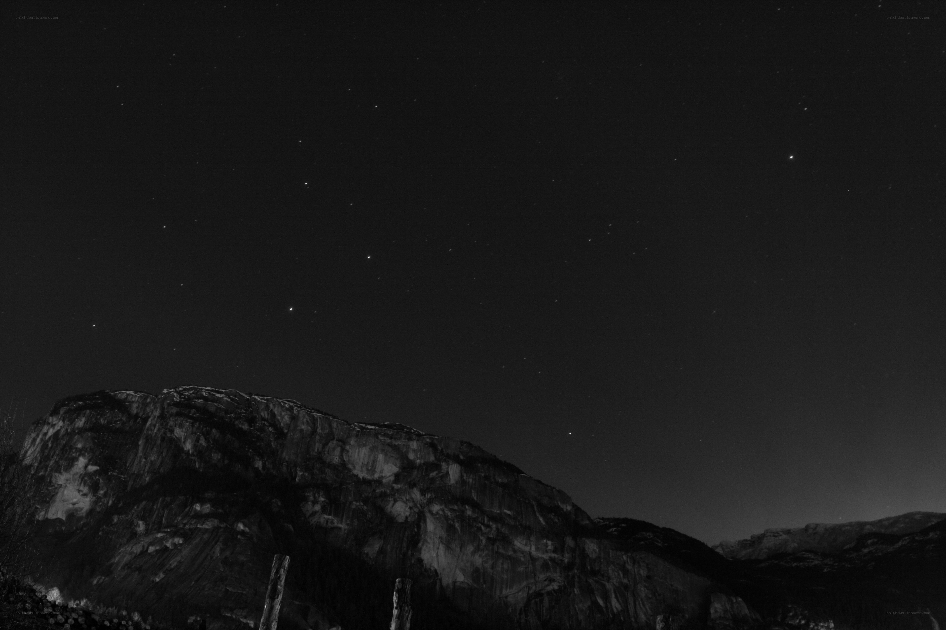 Night sky over rocky mountains