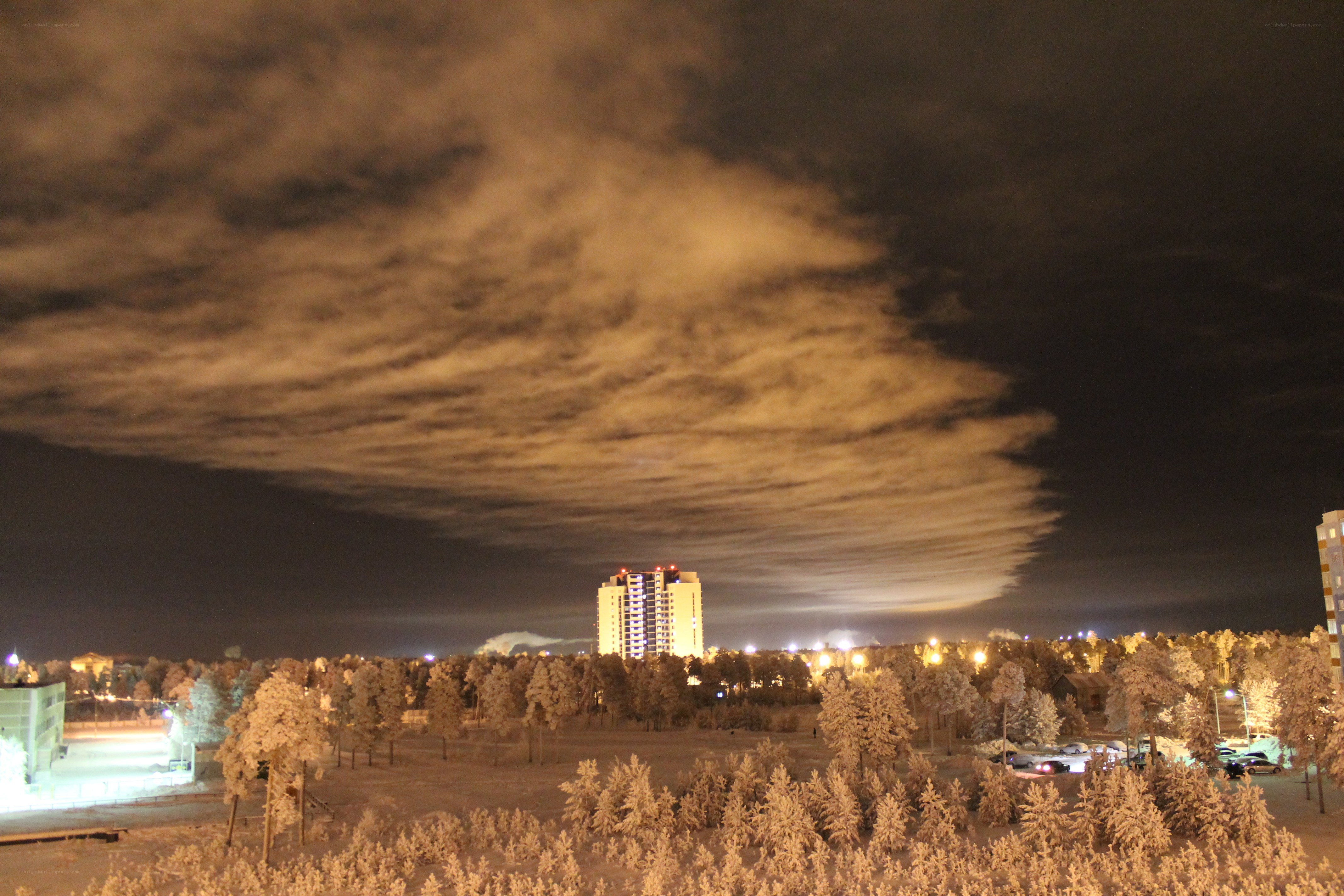 Night sky over snowy city