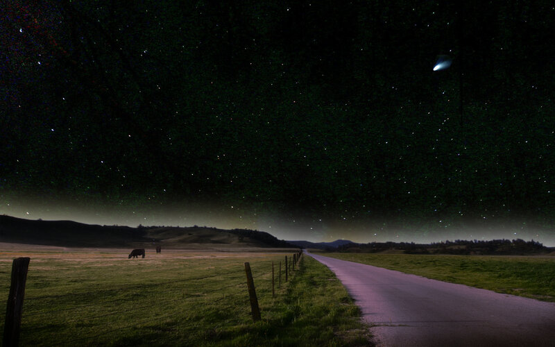Night sky with comet and road