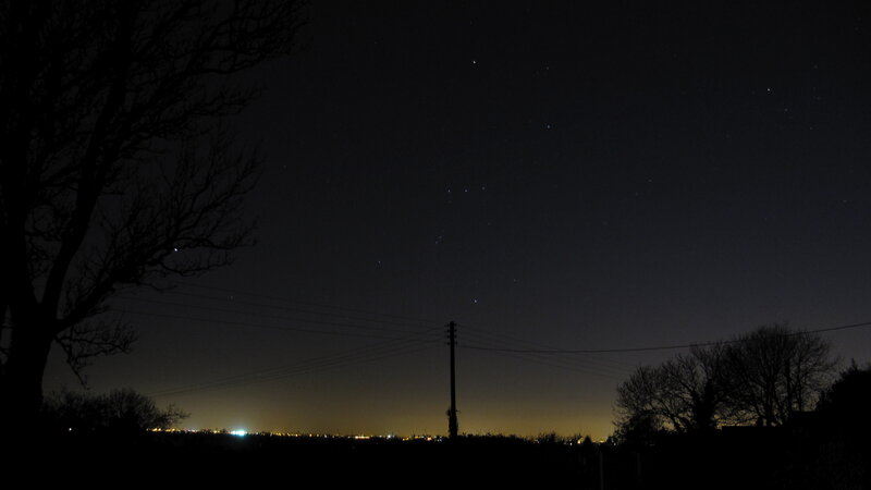 night sky with stars and city lights