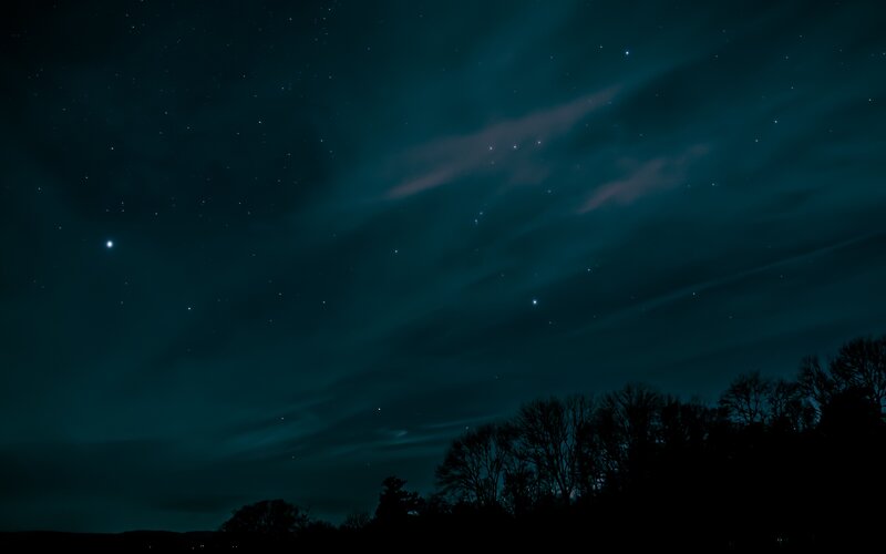 Night sky with stars and clouds