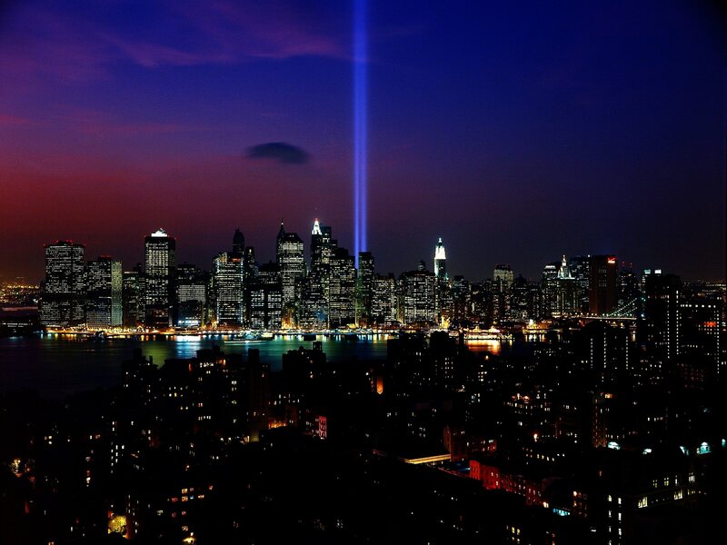Night skyline with light beam