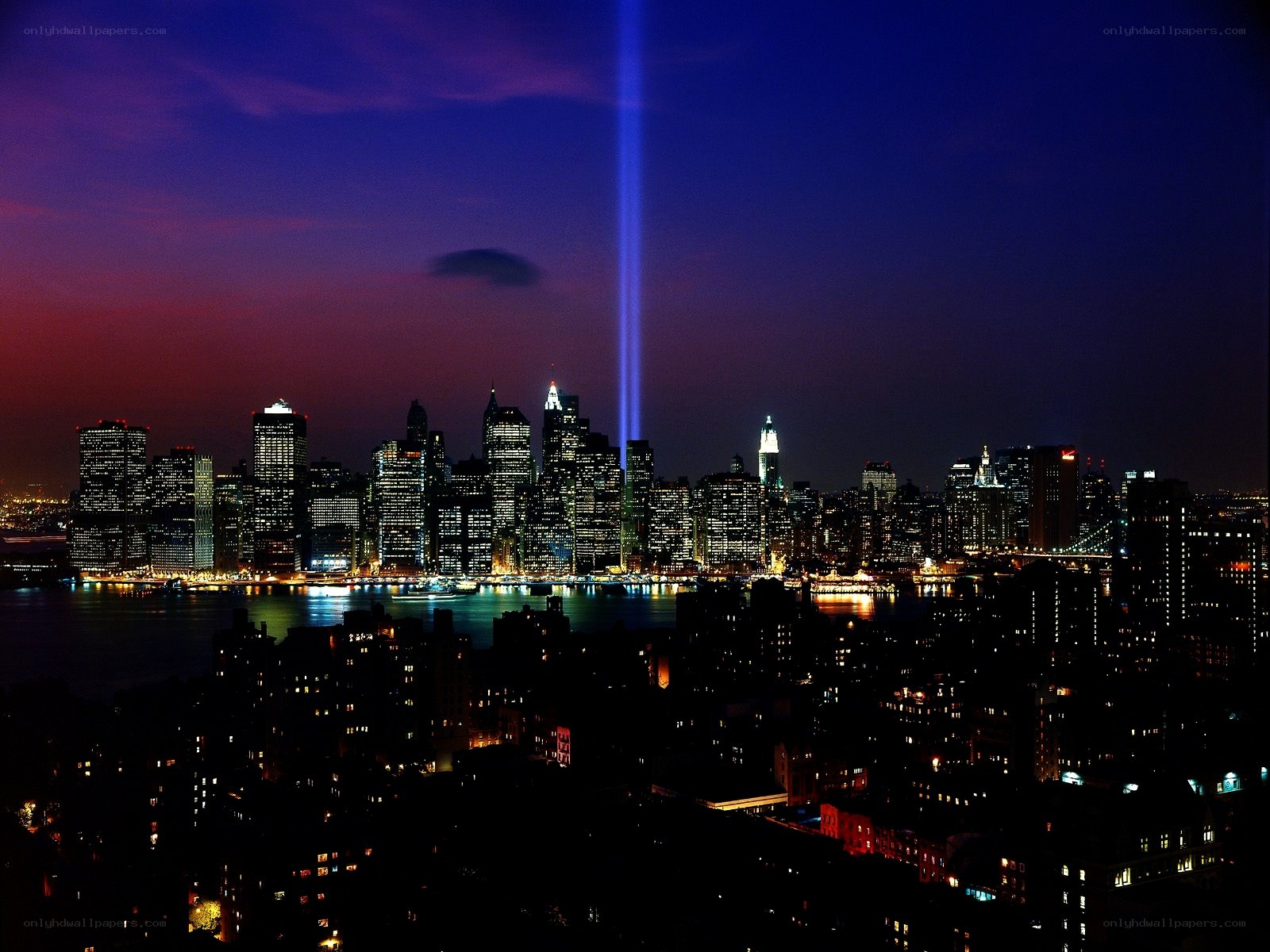 Night skyline with light beam