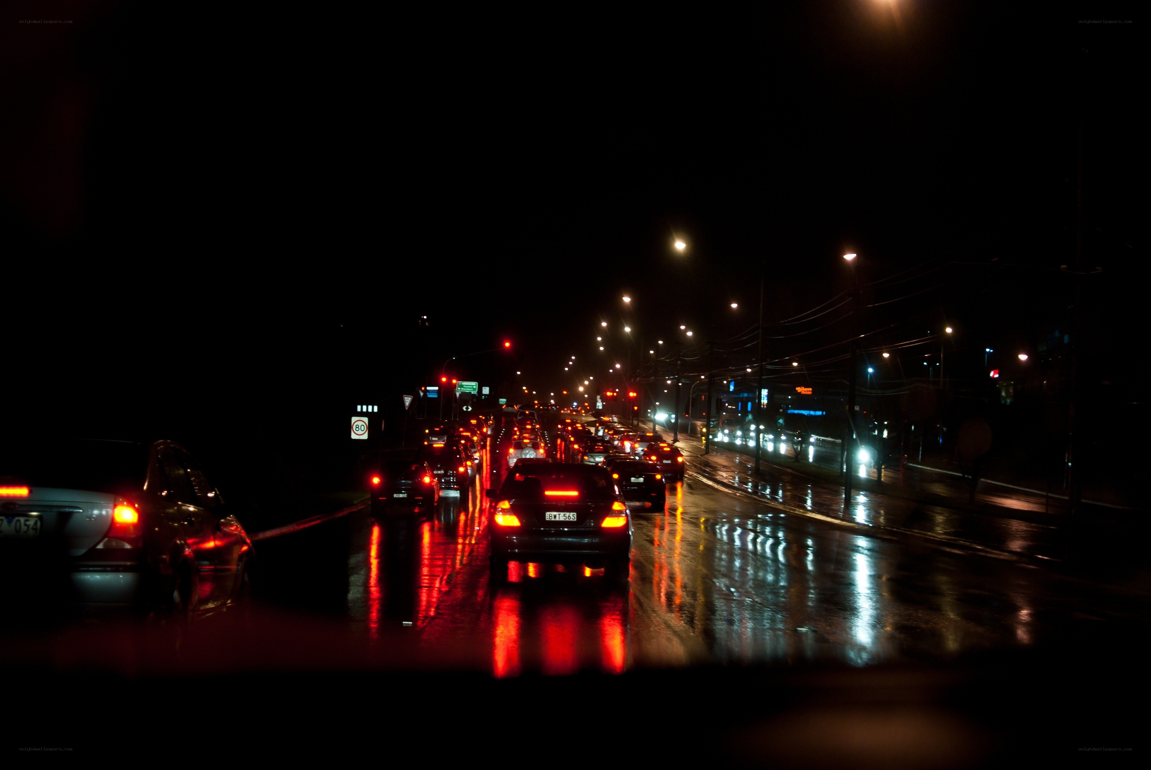 Night traffic on wet road
