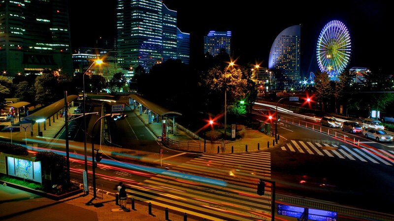 Night view of a city with a Ferris wheel
