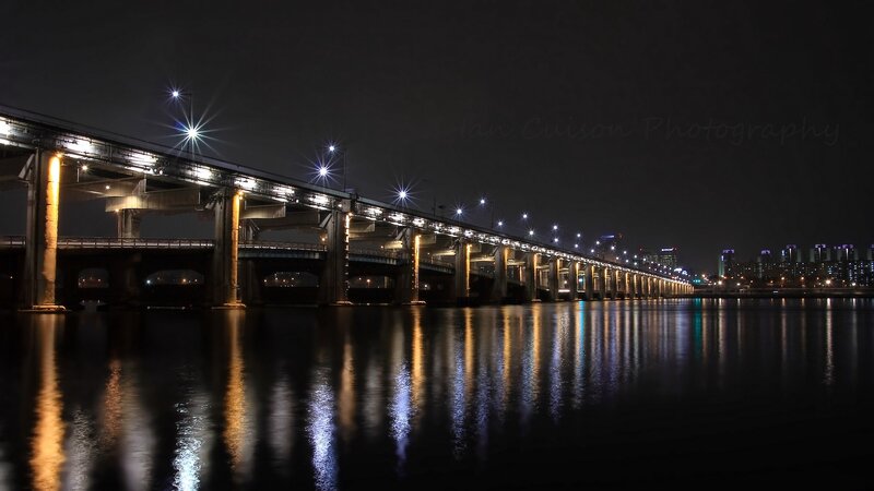 Night view of a lit bridge