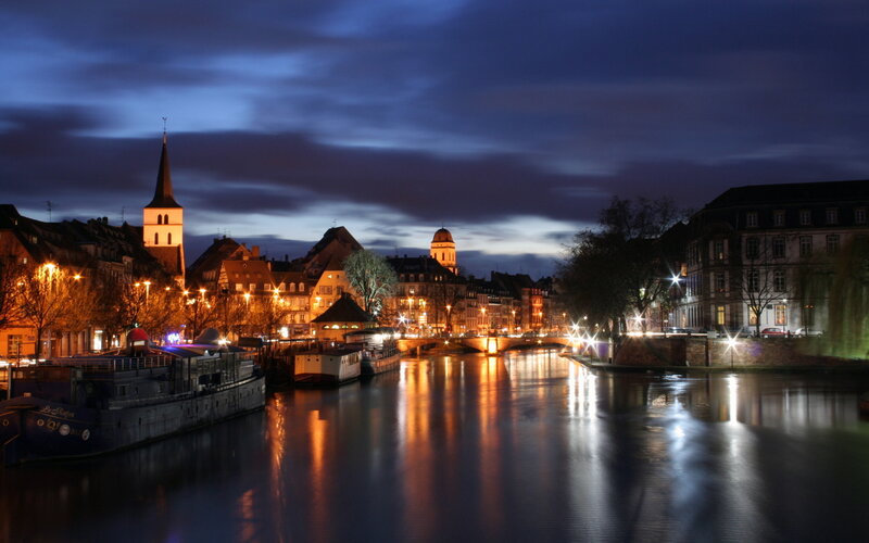 night view of a river in strasbourg