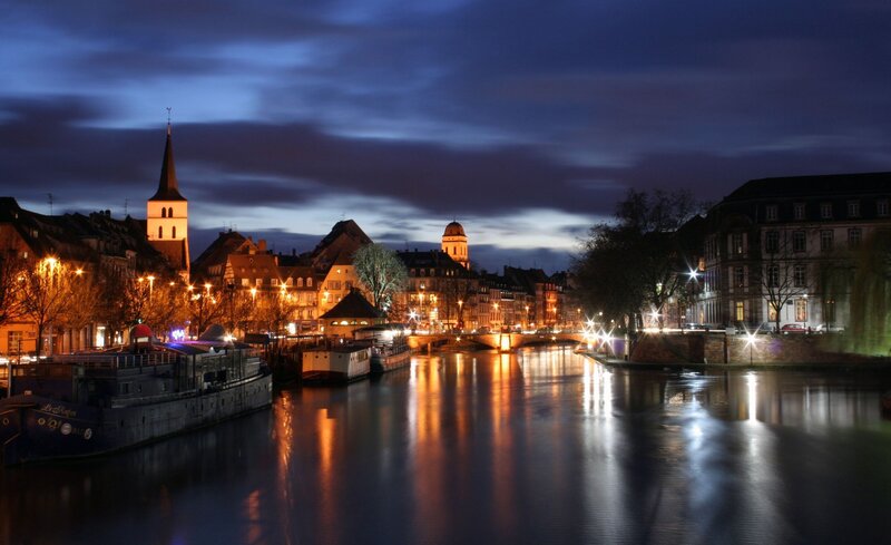 night view of a river in strasbourg