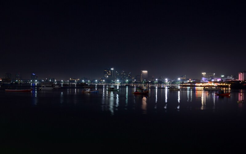 night view of city by water