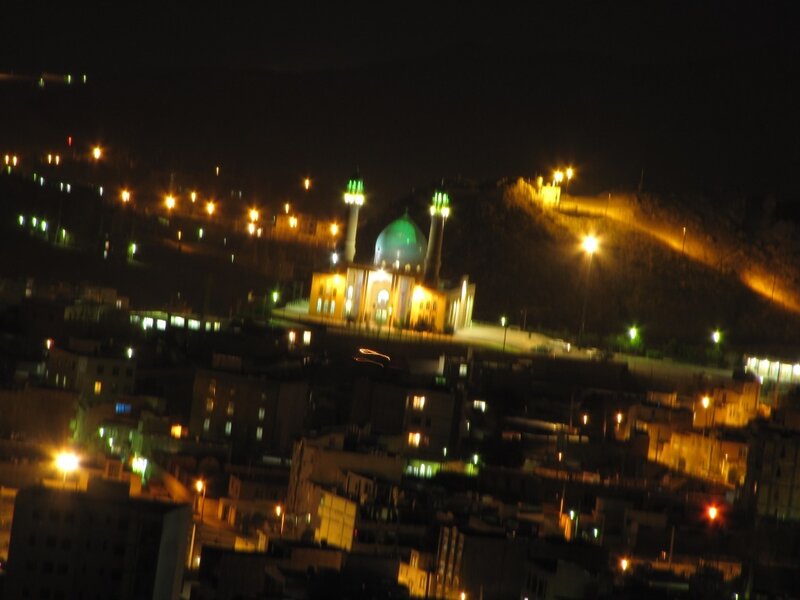 night view of city with mosque