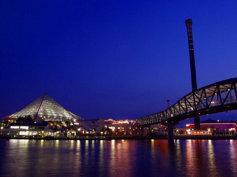 night view of pyramid and bridge