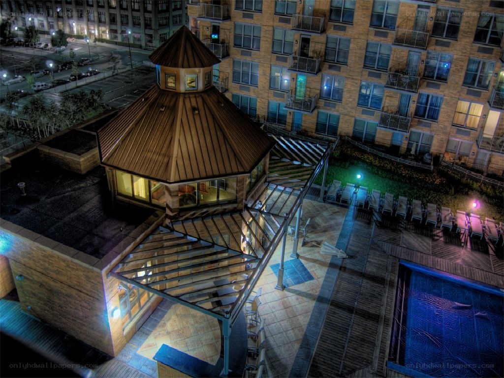 Night view of rooftop pool area