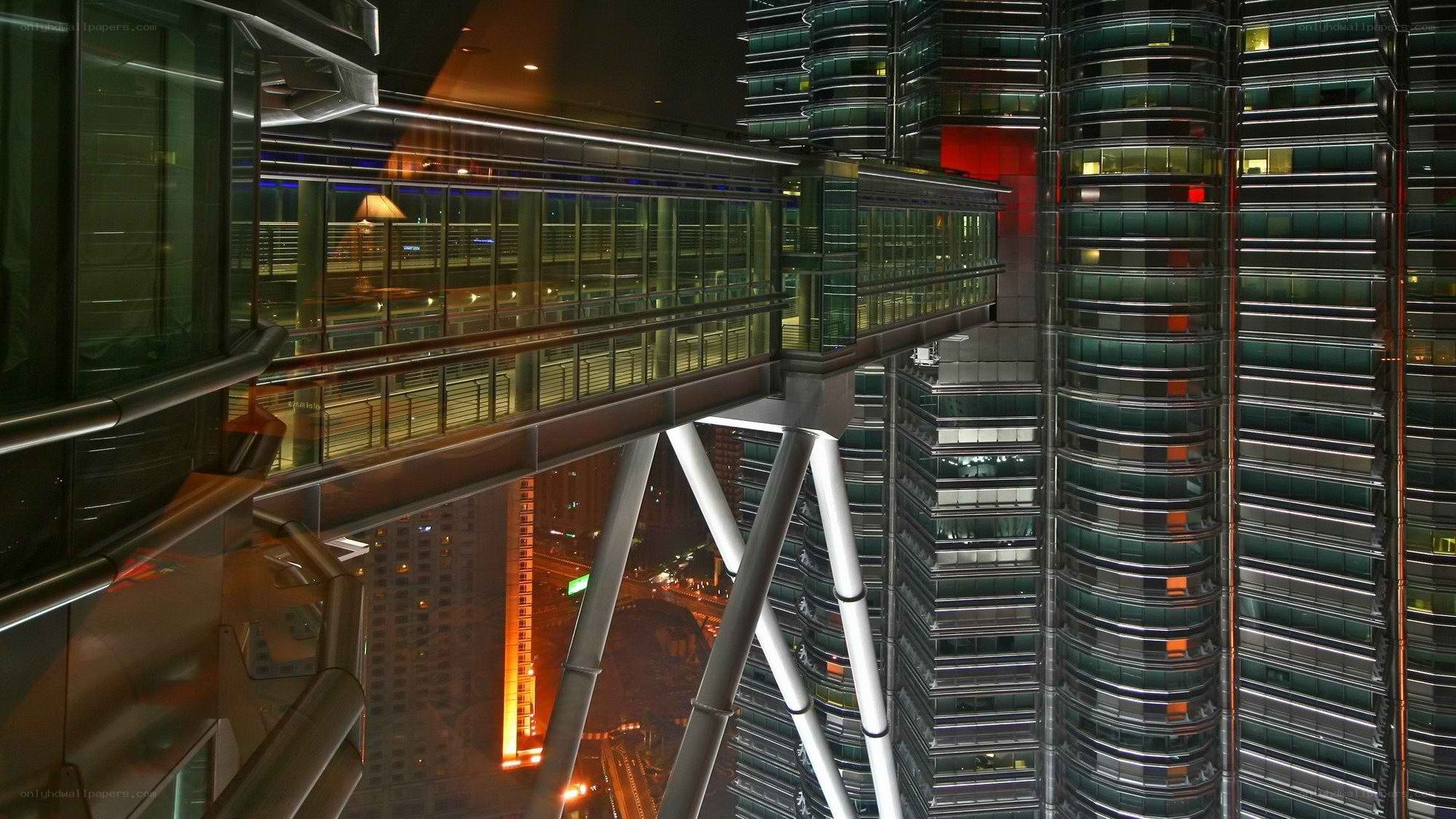 night view of skyscraper bridge