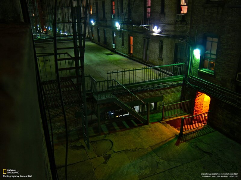 Nighttime alley with fire escape