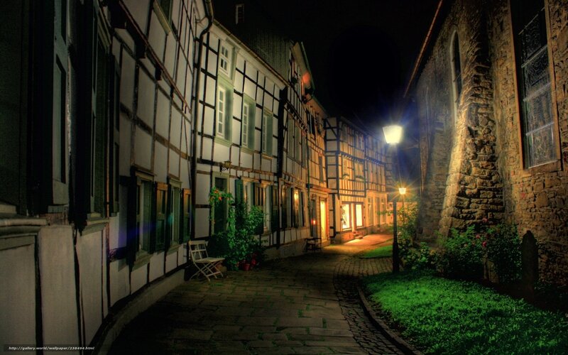 nighttime alley with half-timbered houses