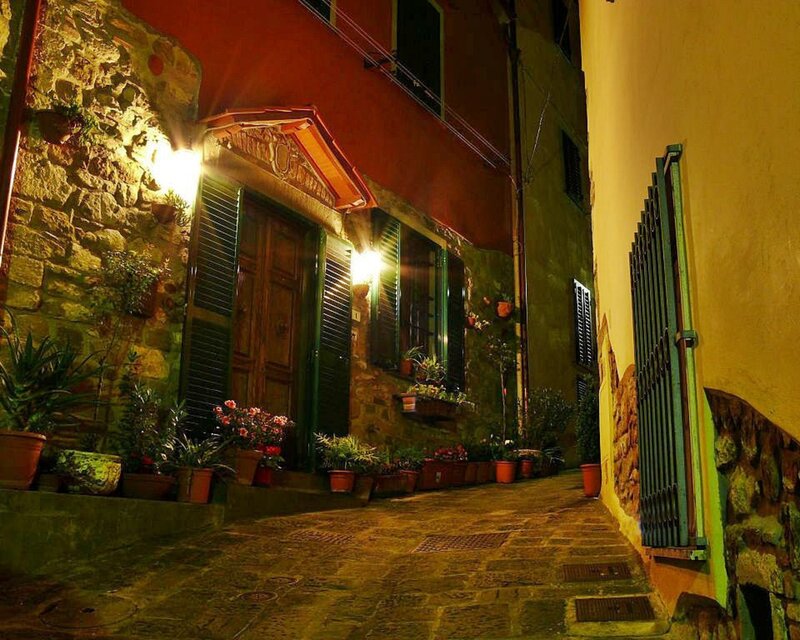nighttime alley with stone buildings