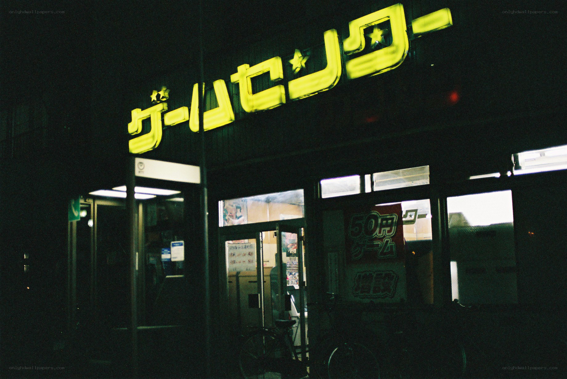 nighttime arcade storefront