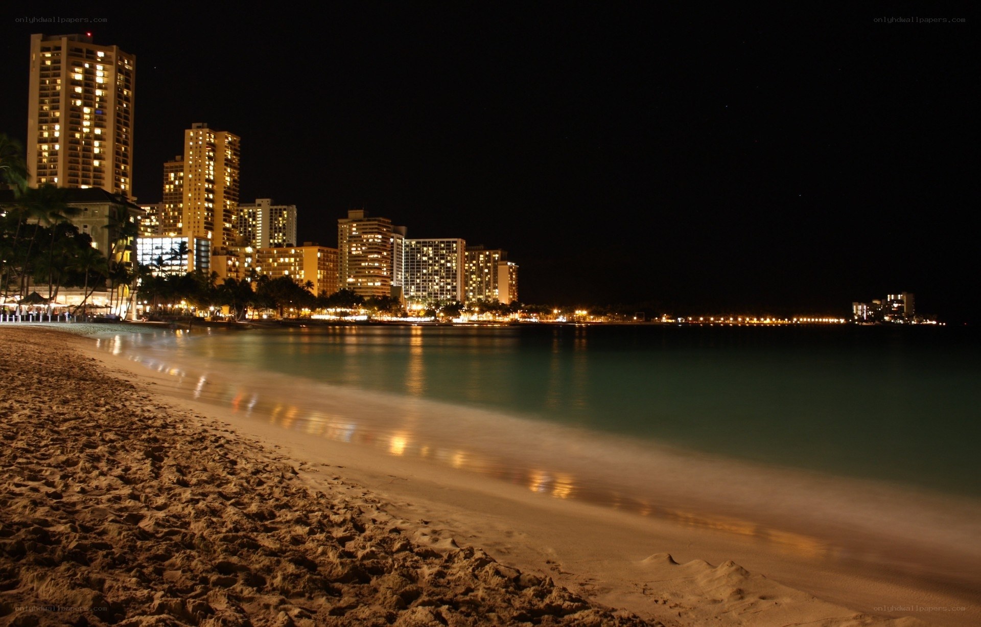 nighttime beach cityscape
