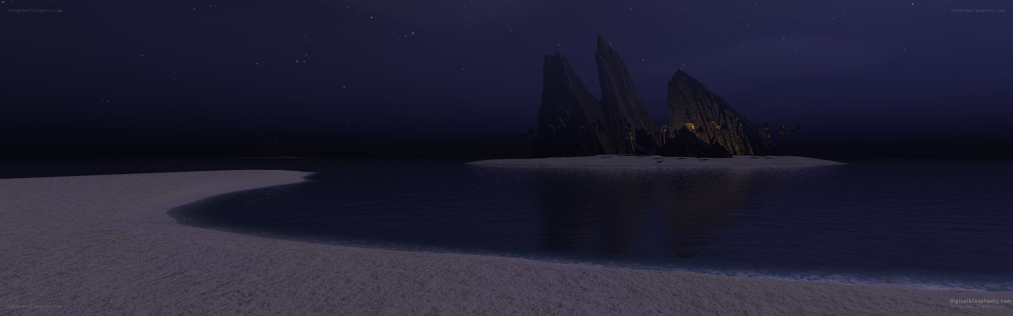 nighttime beach with rocky island