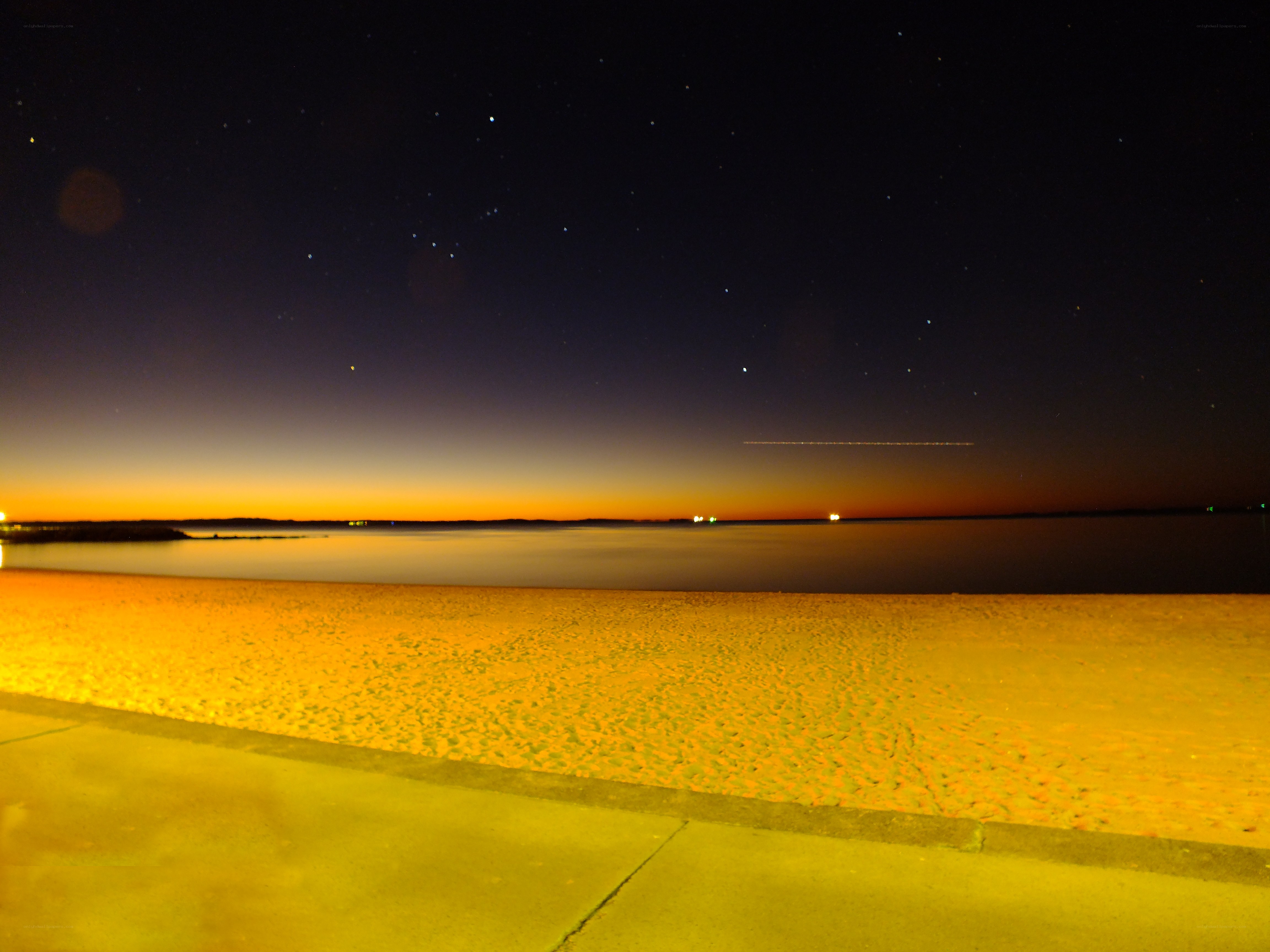 nighttime beach with starry sky