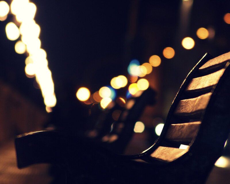 Nighttime bench with bokeh lights
