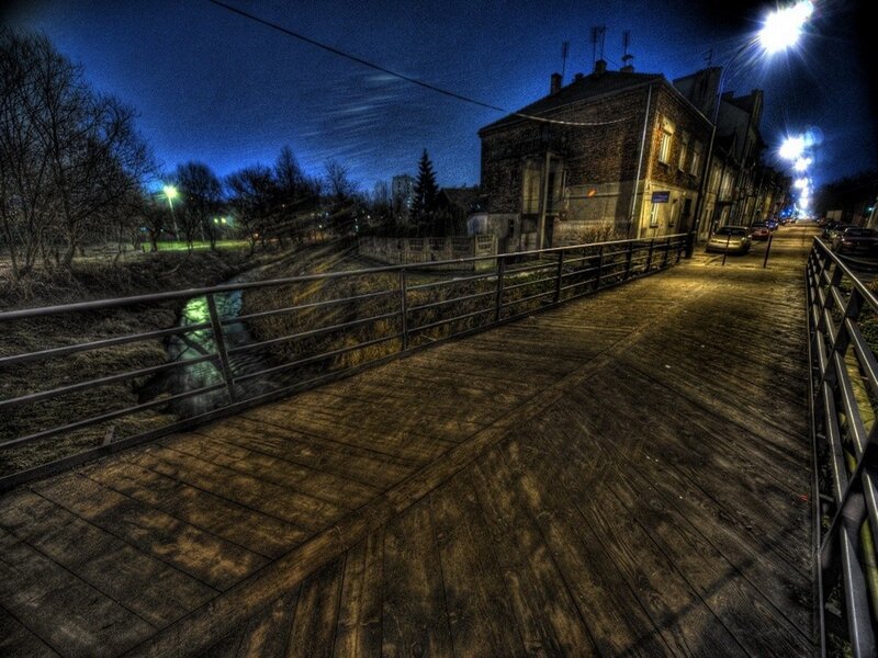 nighttime bridge over canal
