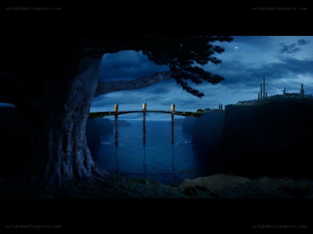 nighttime bridge to a distant city